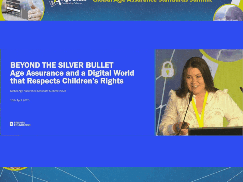 Wide shot of the Global Age Assurance Standard Summit 2025 stage, showing Marie-Ève Nadeau presenting alongside a large screen displaying the 5Rights Foundation’s session title: “Beyond the Silver Bullet: Age Assurance and a Digital World that Respects Children’s Rights.”